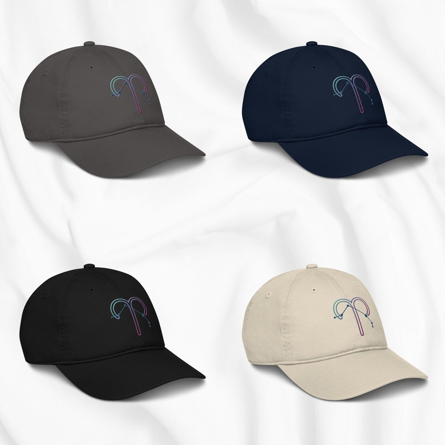 Four baseball caps in different colors with an embroidered Aries zodiac design on a white background