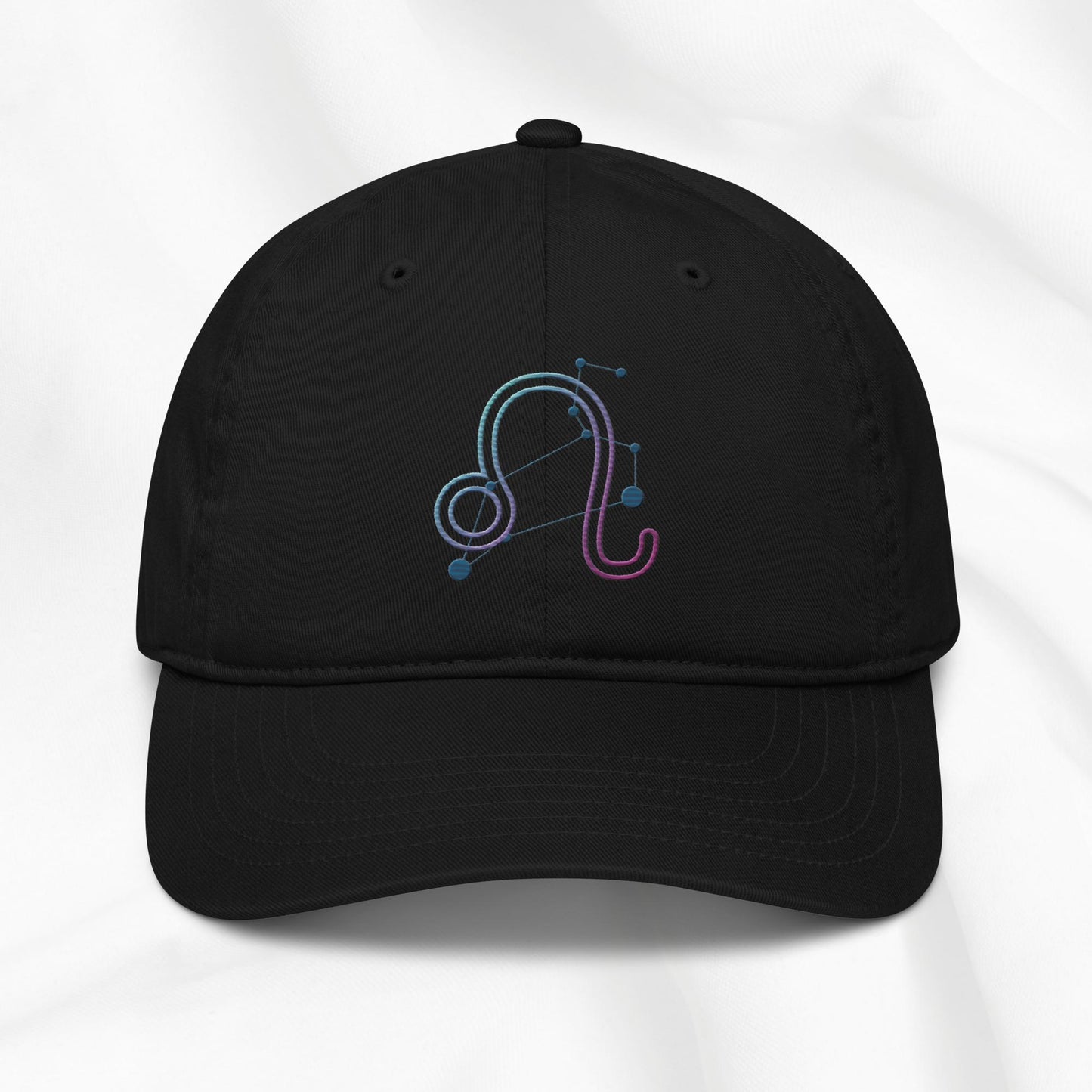Black organic cotton baseball cap with embroidered Leo zodiac design on a white background