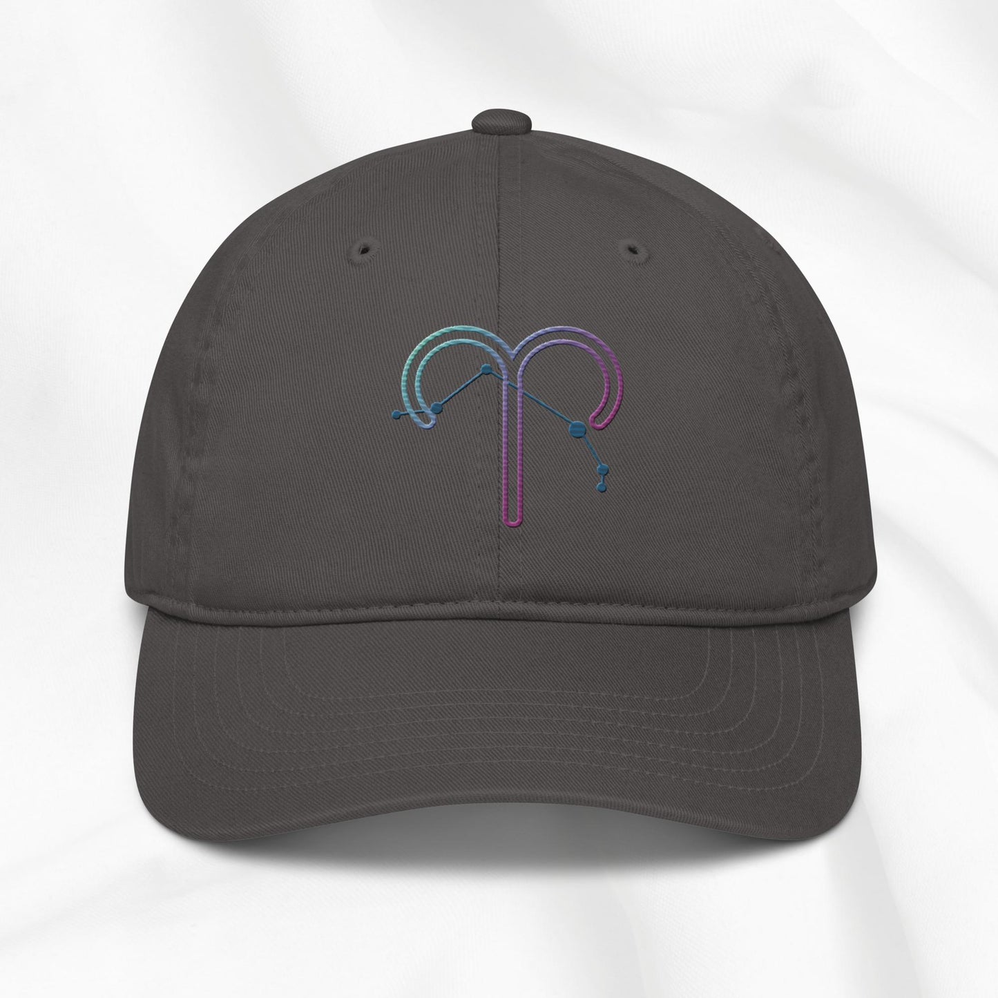 Gray organic cotton baseball cap with an embroidered Aries zodiac design on a white background
