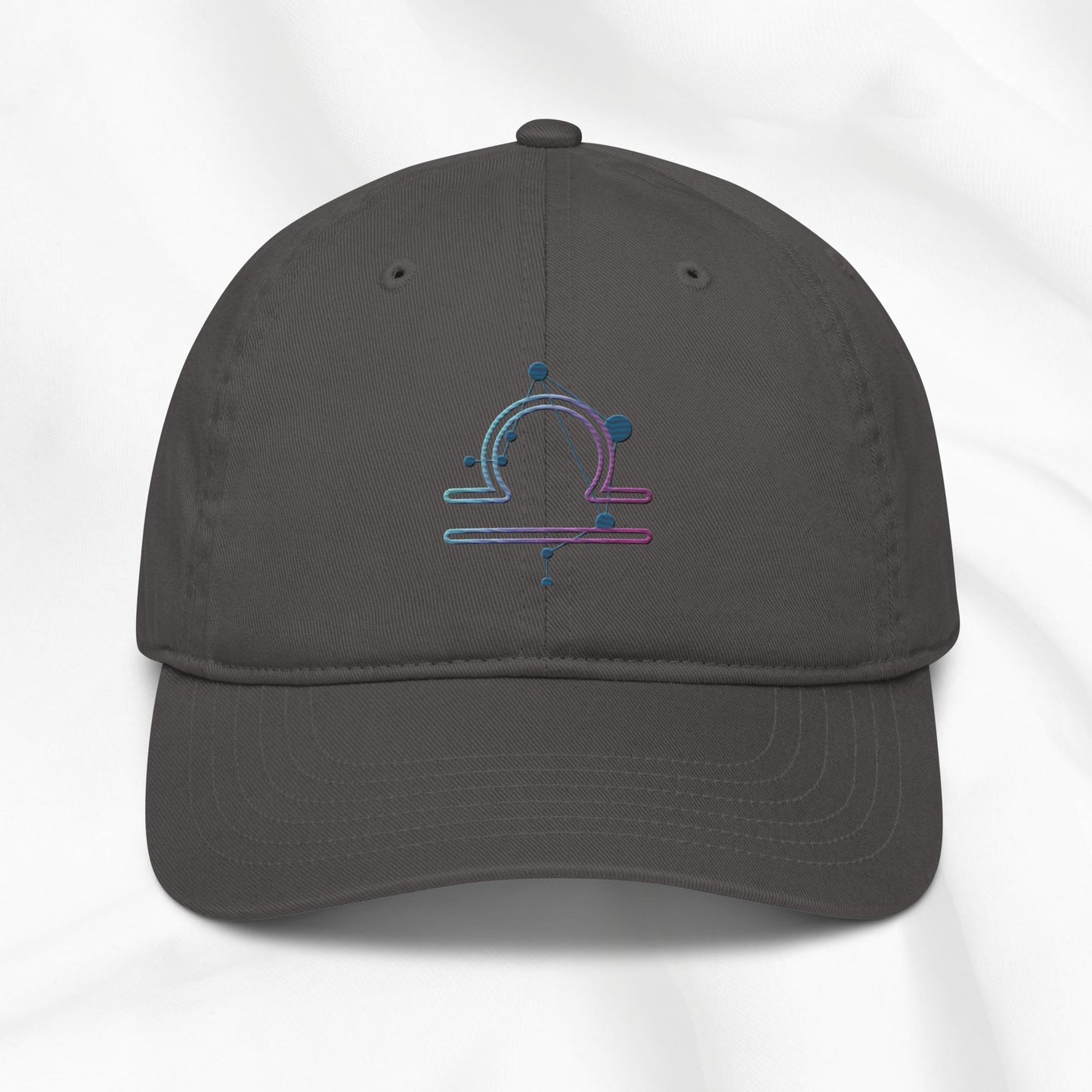 Gray organic cotton baseball cap with an embroidered libra zodiac design on a white background