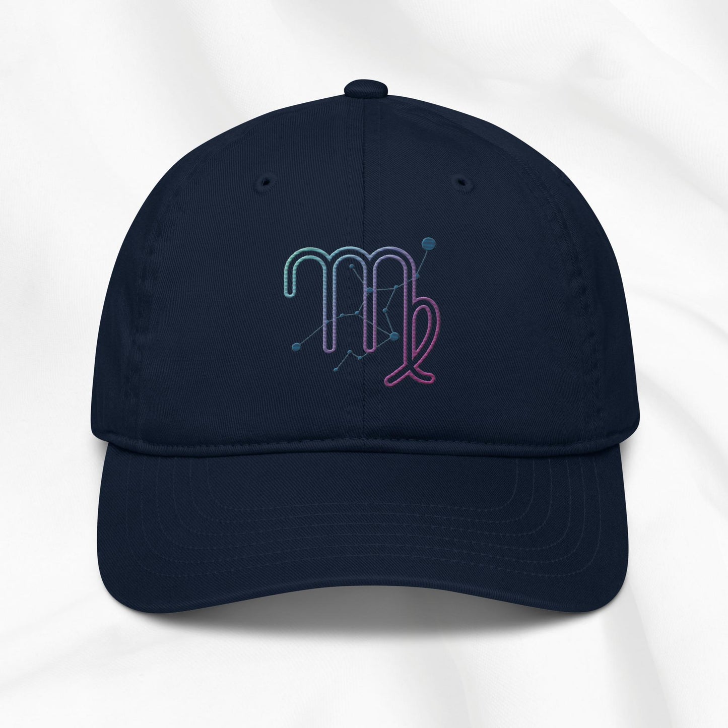 Navy organic cotton baseball cap with an embroidered virgo zodiac design on a white background.
