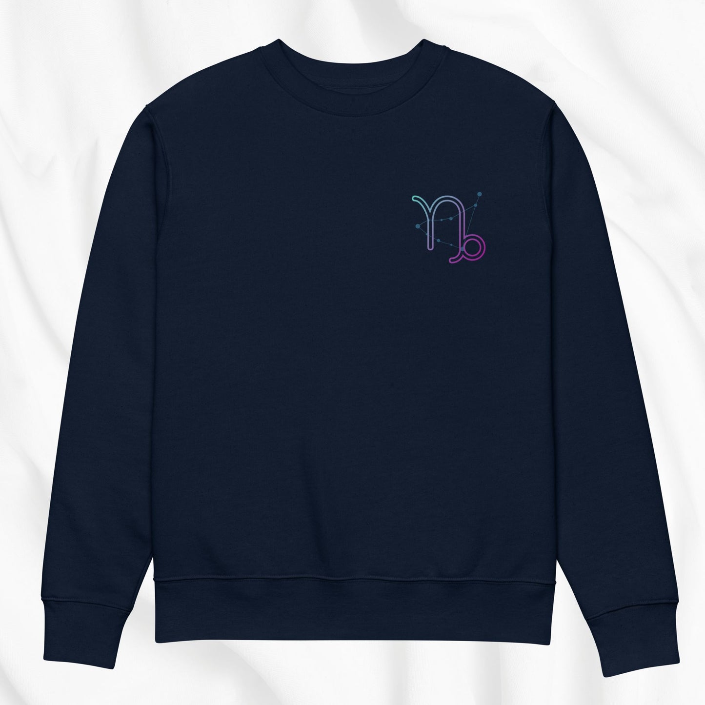 Navy blue sweatshirt with a colorful Capricorn design on the chest against a white background
