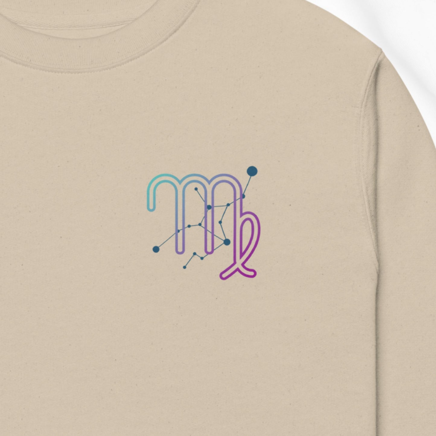 Beige sweatshirt with a colorful 'Aries' zodiac symbol design on a plain background
