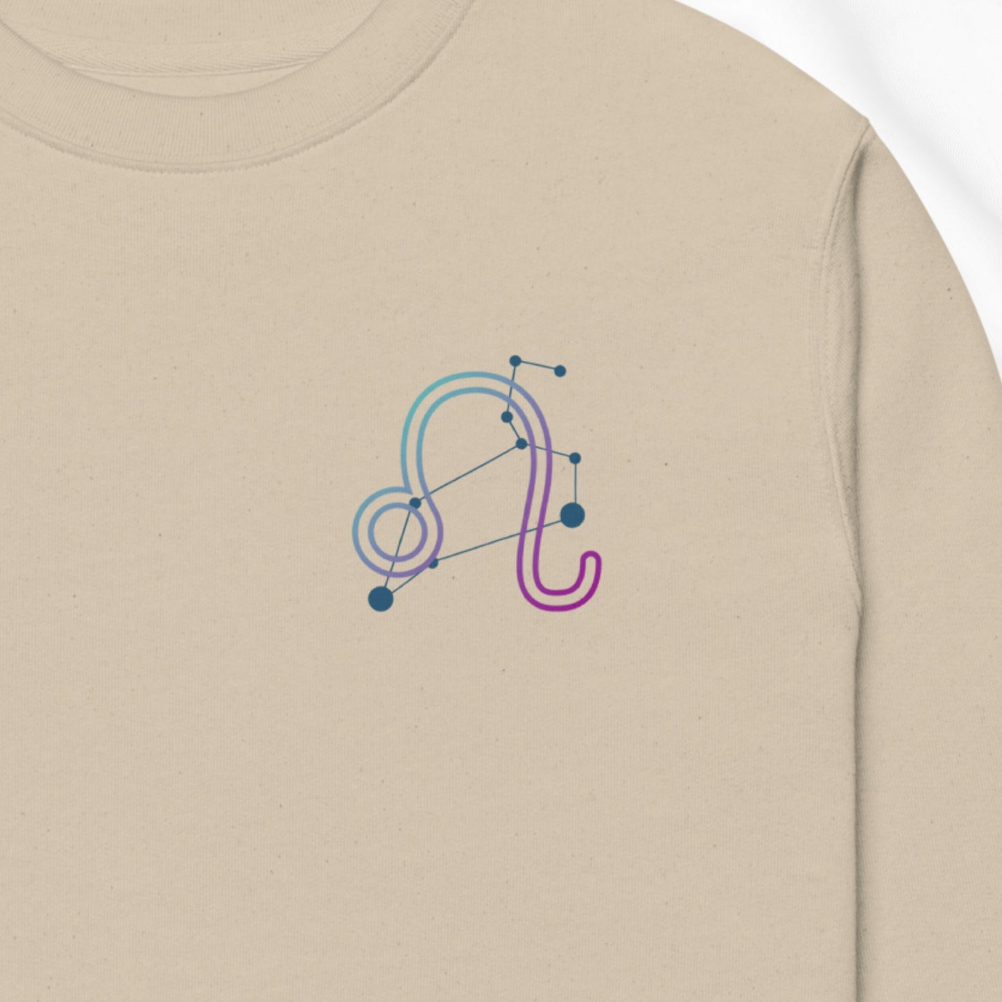 Beige sweatshirt with a colorful zodiac design printed on the chest