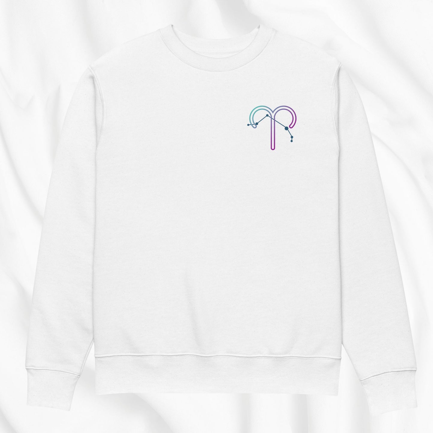 White sweatshirt with a colorful printed zodiac design on a white background