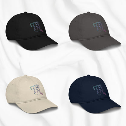 Four baseball caps in black, gray, beige, and navy with embroidered scorpio zodiac designs on a white background.