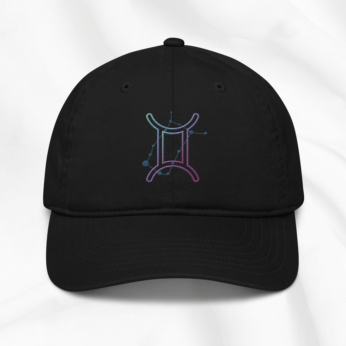 Black organic cotton baseball cap with embroidered gemini graphic on white background