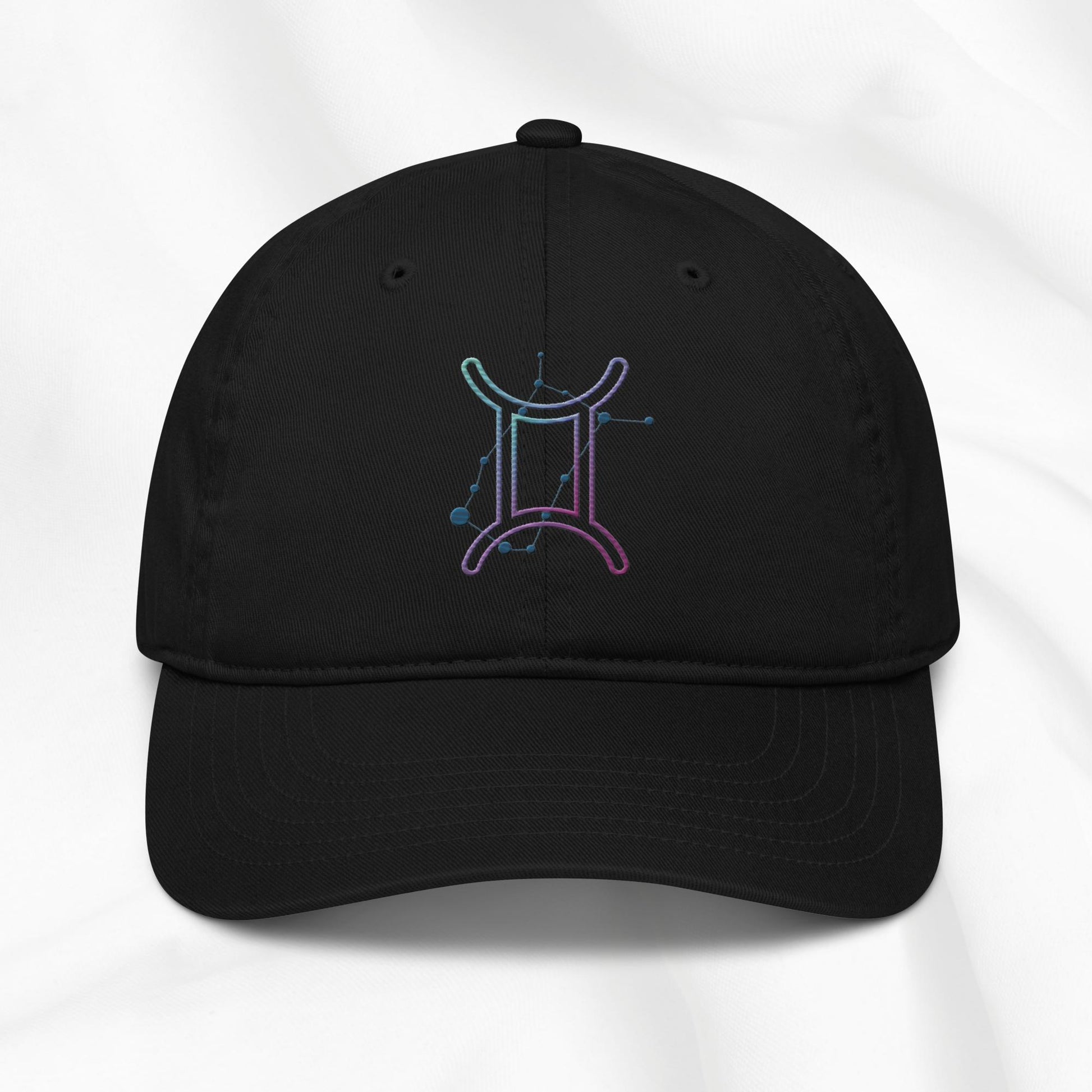 Black organic cotton baseball cap with embroidered gemini graphic on white background