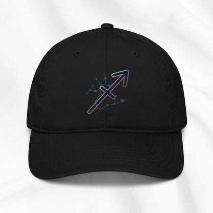 Black organic cotton baseball cap with Sagittarius zodiac embroidered graphic on a white background.