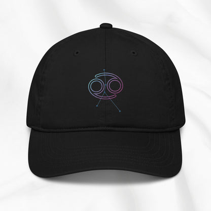 Black organic cotton baseball cap with embroidered Cancer zodiac graphic on a white background