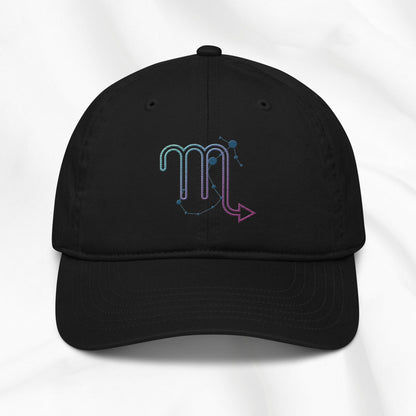 Black organic cotton baseball cap with an embroidered scorpio zodiac graphic on a white background. 