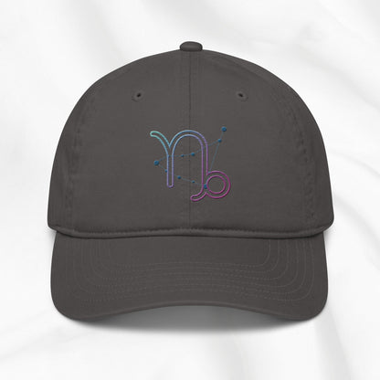 gray organic cotton baseball cap with embroidered capricorn graphic on white background