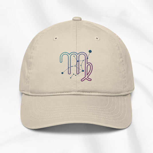 Beige organic cotton baseball cap with an embroidered virgo zodiac design on a white background