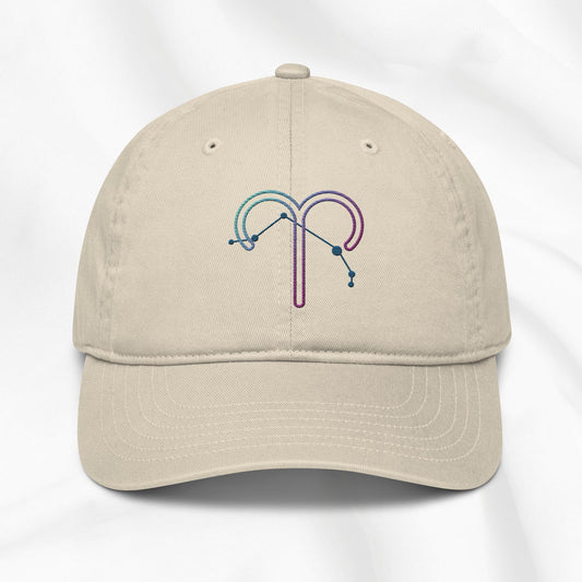 Beige organic cotton baseball cap with an embroidered Aries zodiac design on a white background 