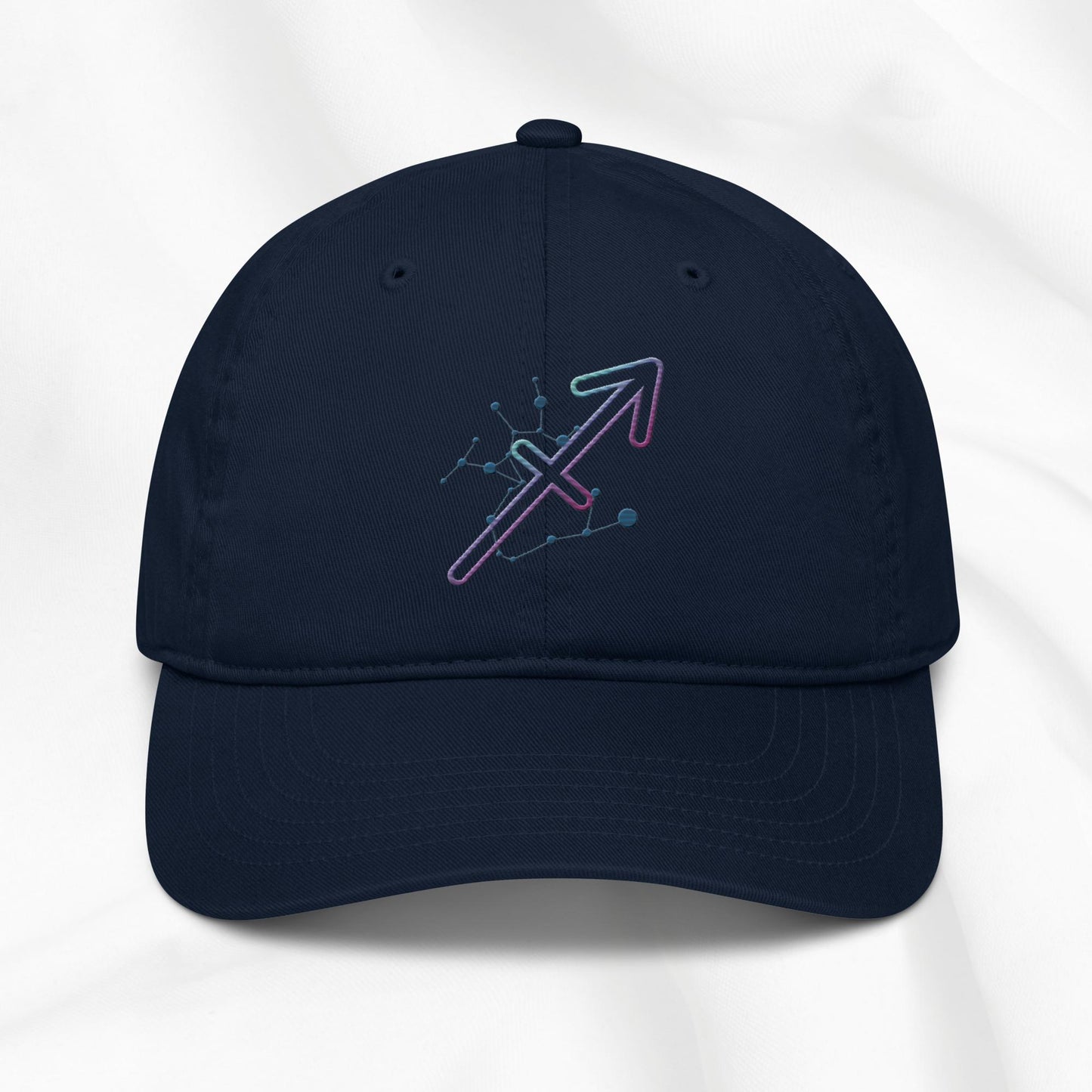 Navy organic cotton baseball cap with Sagittarius zodiac embroidered graphic on a white background.