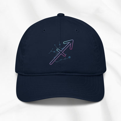 Navy organic cotton baseball cap with Sagittarius zodiac embroidered graphic on a white background.