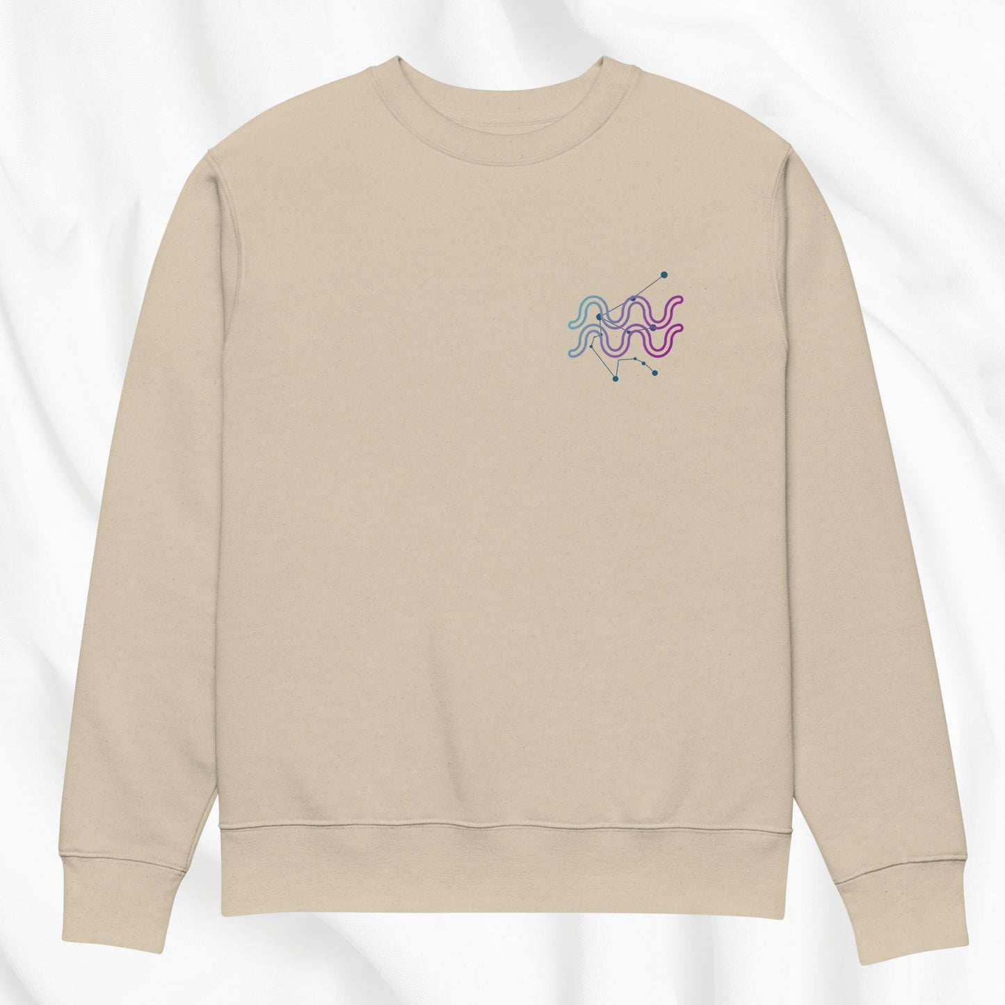 Beige sweatshirt with a colorful Aquarius design on a white background