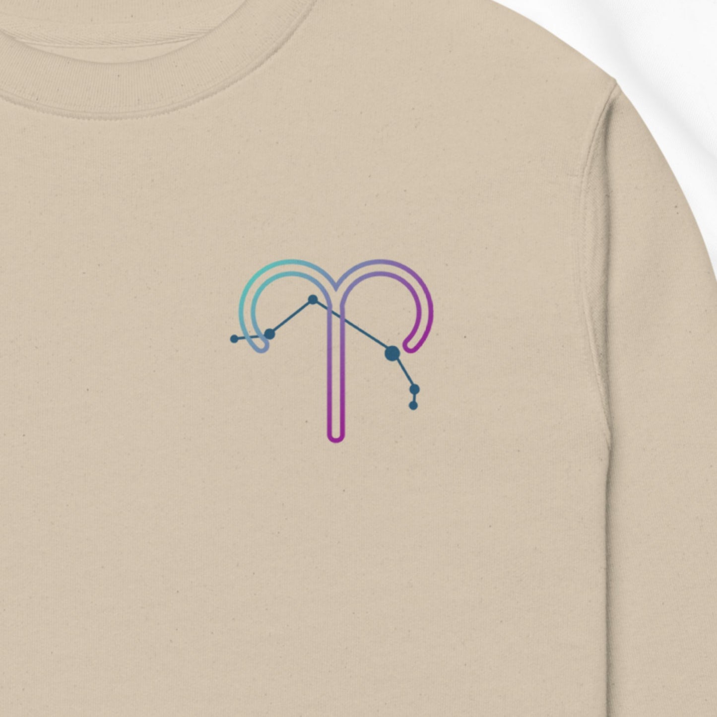 Beige sweatshirt with a colorful constellation design on the chest.