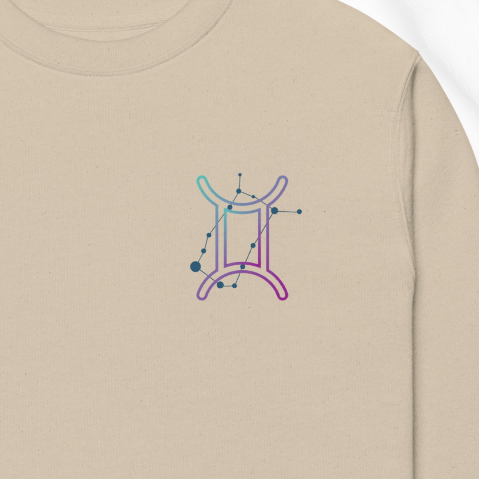 Beige sweatshirt with a gemini zodiac print design on the chest
