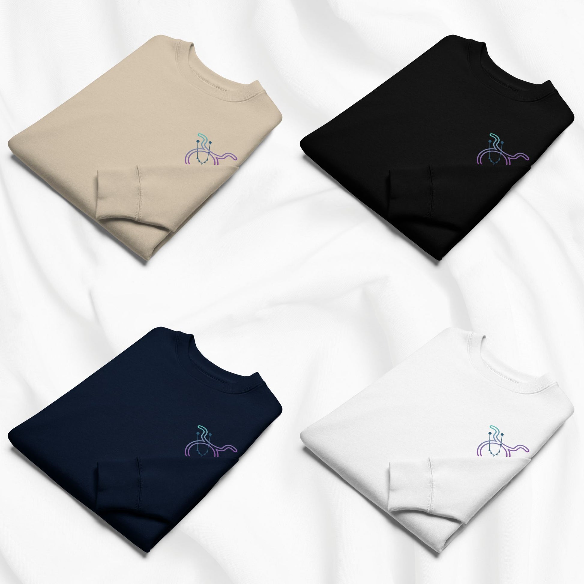 Four folded sweatshirts in beige, black, navy, and white with a taurus zodiac print on a white background
